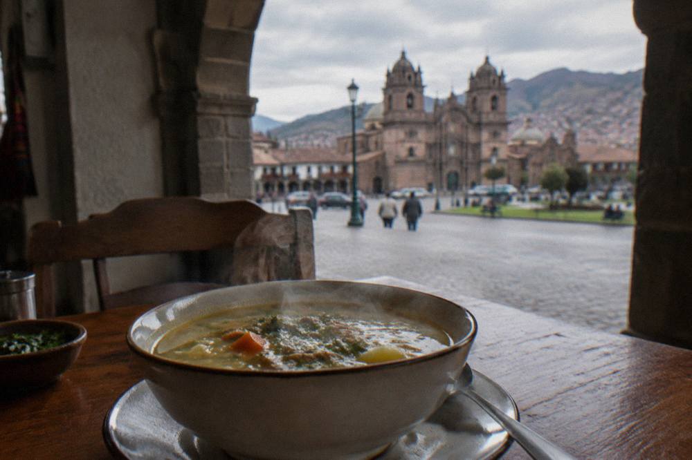 A steaming bowl of soup served at a simple eatery in Cusco, Peru