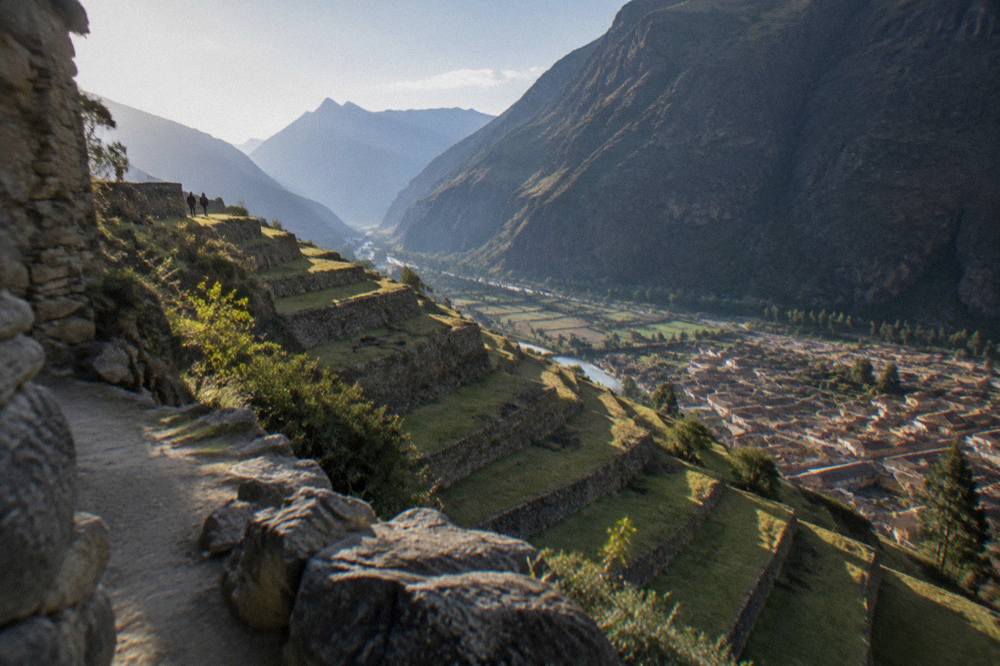 Inca agricultural terraces stepping down a hillside above the town of Ollantaytambo