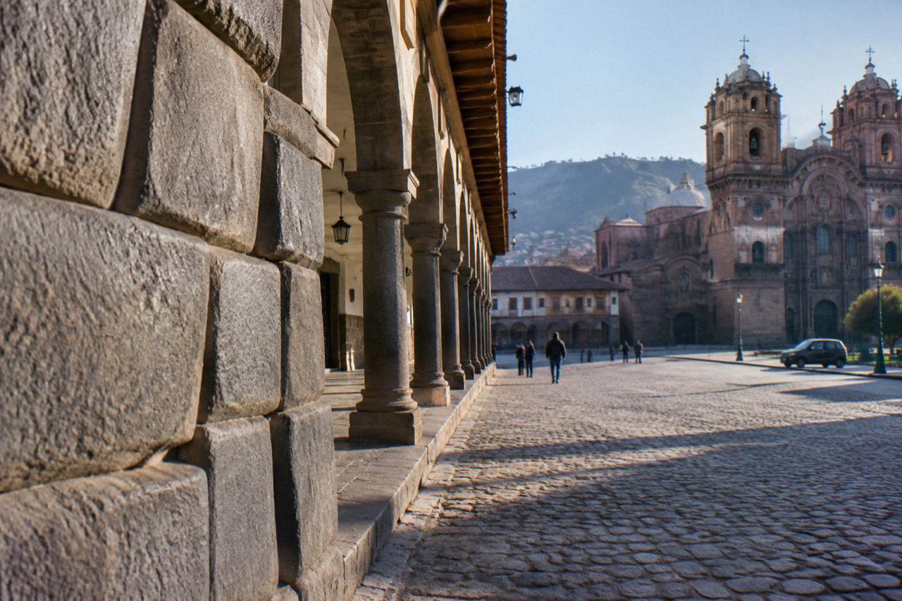 Inca stone walls beneath colonial arcades in the historic centre of Cusco, Peru