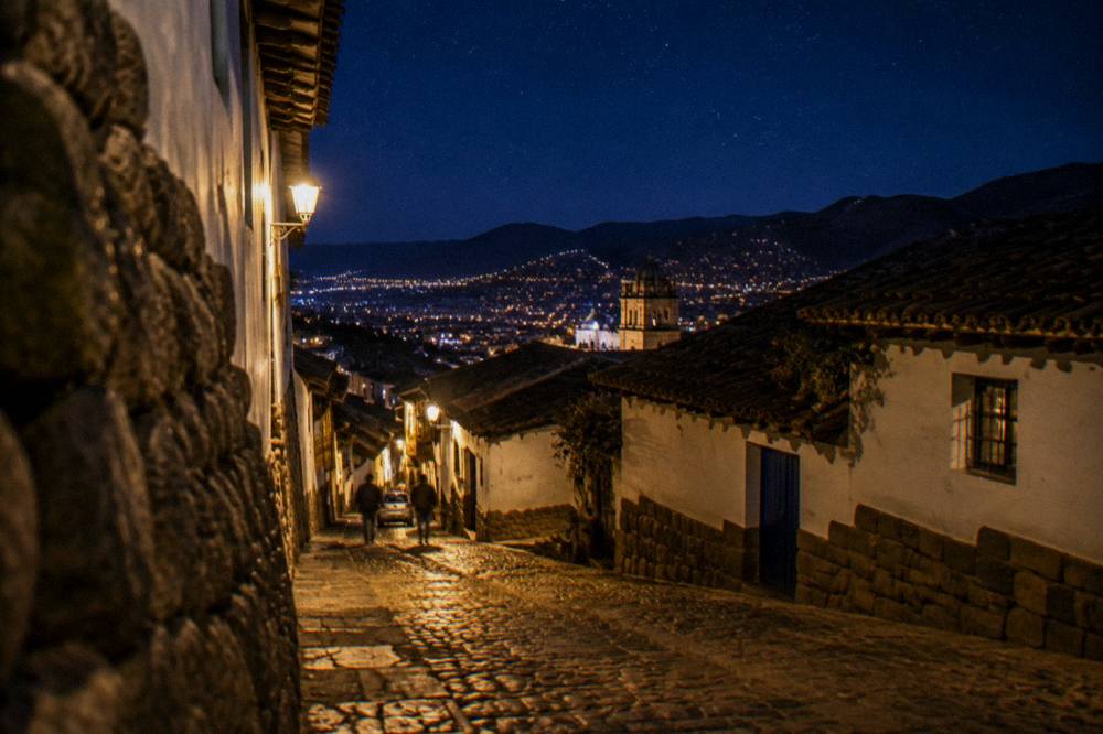 Night sky with stars above the rooftops of Cusco, Peru