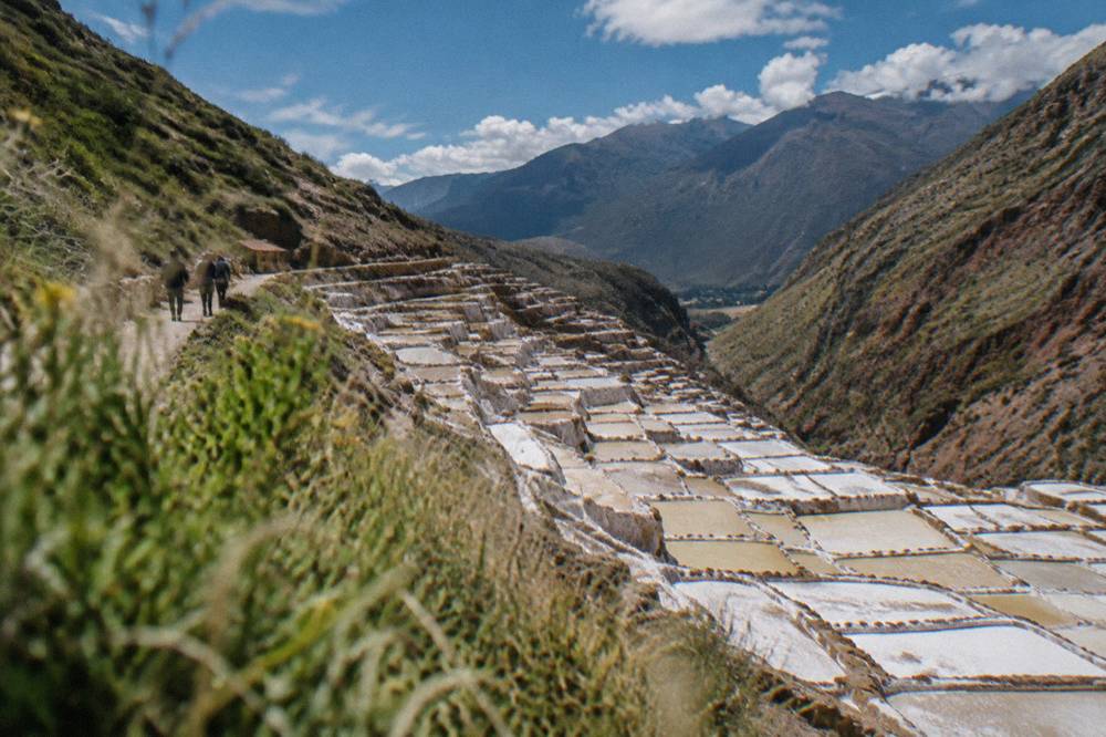 Terraced salt evaporation ponds at Maras seen from a hillside path