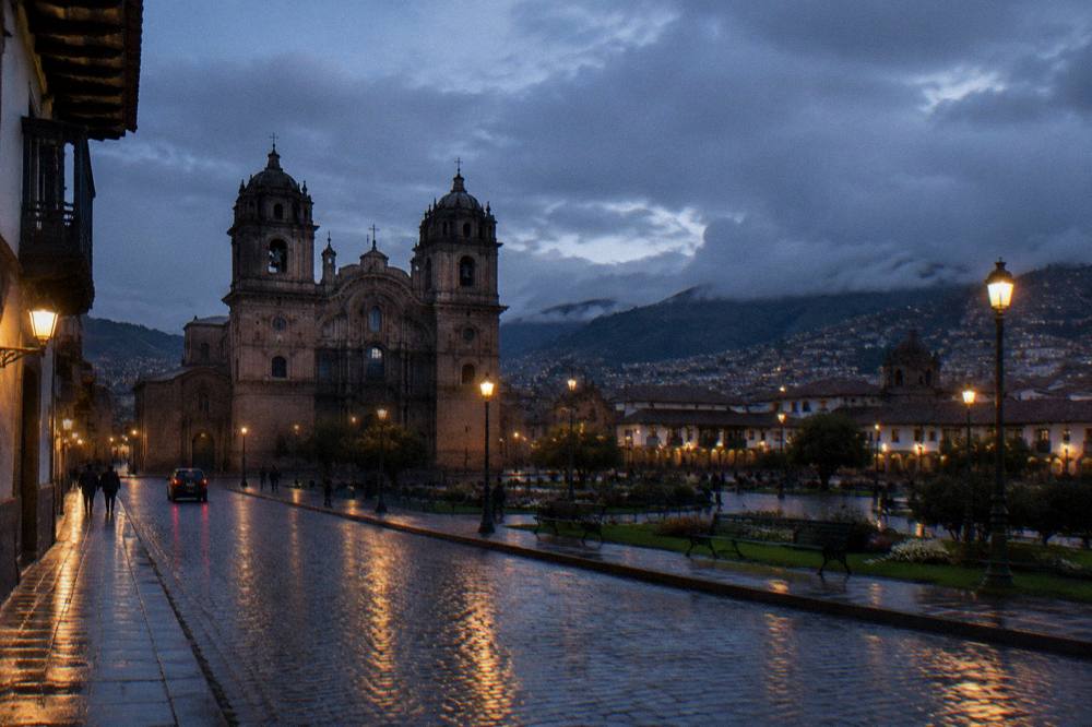 Rain clouds over the rooftops of central Cusco with wet stone streets below