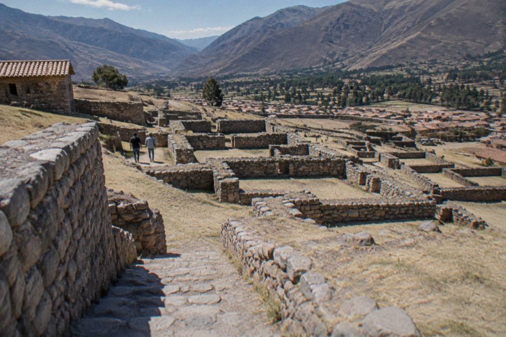A grid of low stone walls and small rectangular rooms on a hillside
