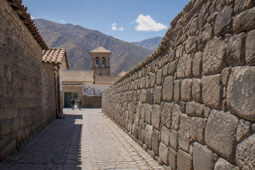 Straight stone walls forming narrow empty streets inside an ancient compound