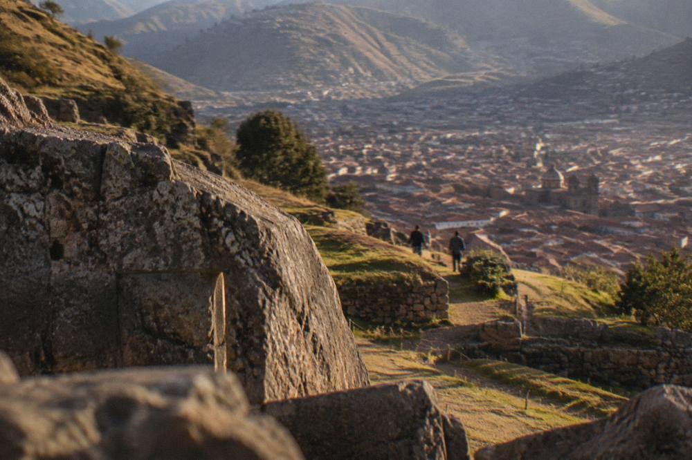 Terraced hillside above Cusco with the city's red roofs in the valley below
