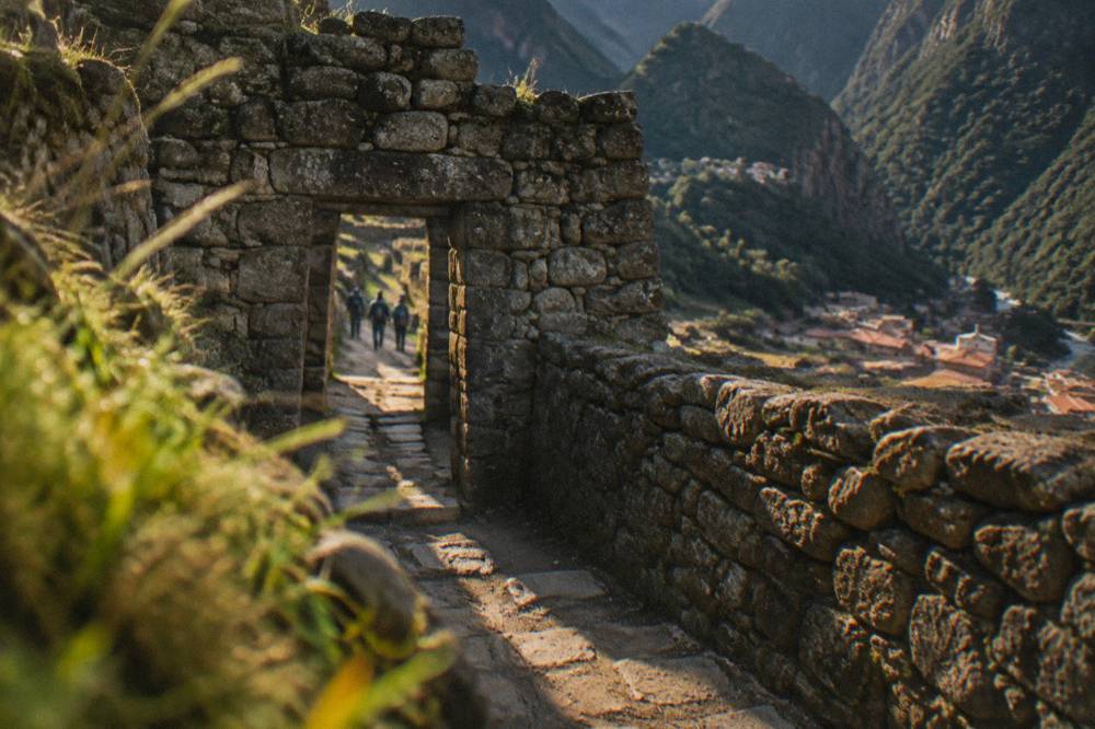 A stone doorway and narrow passageway among Machu Picchu ruins