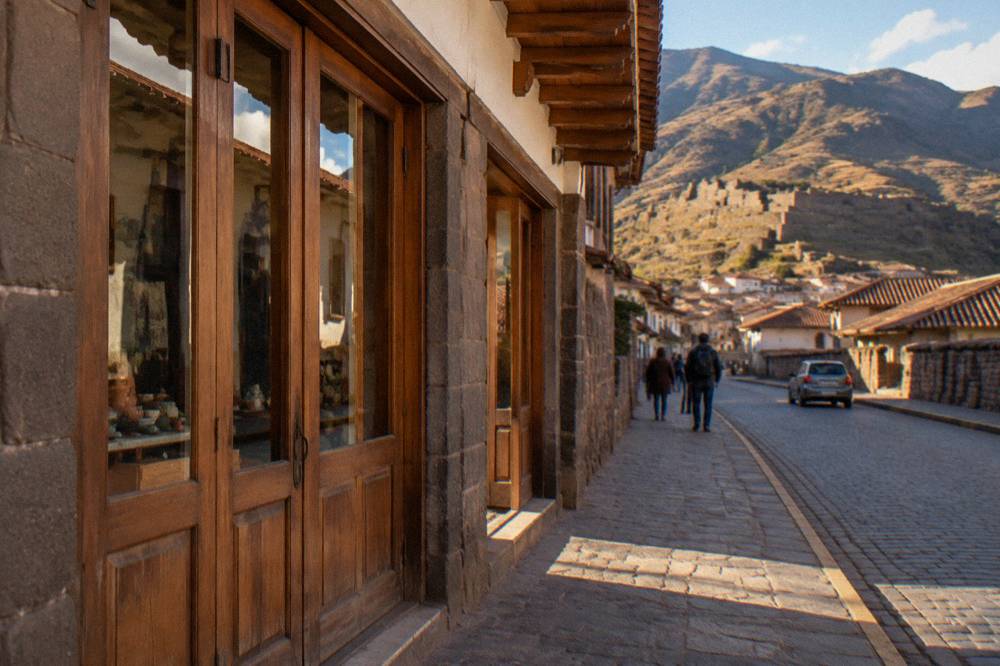 Wooden doors of a gallery storefront on a Cusco avenue