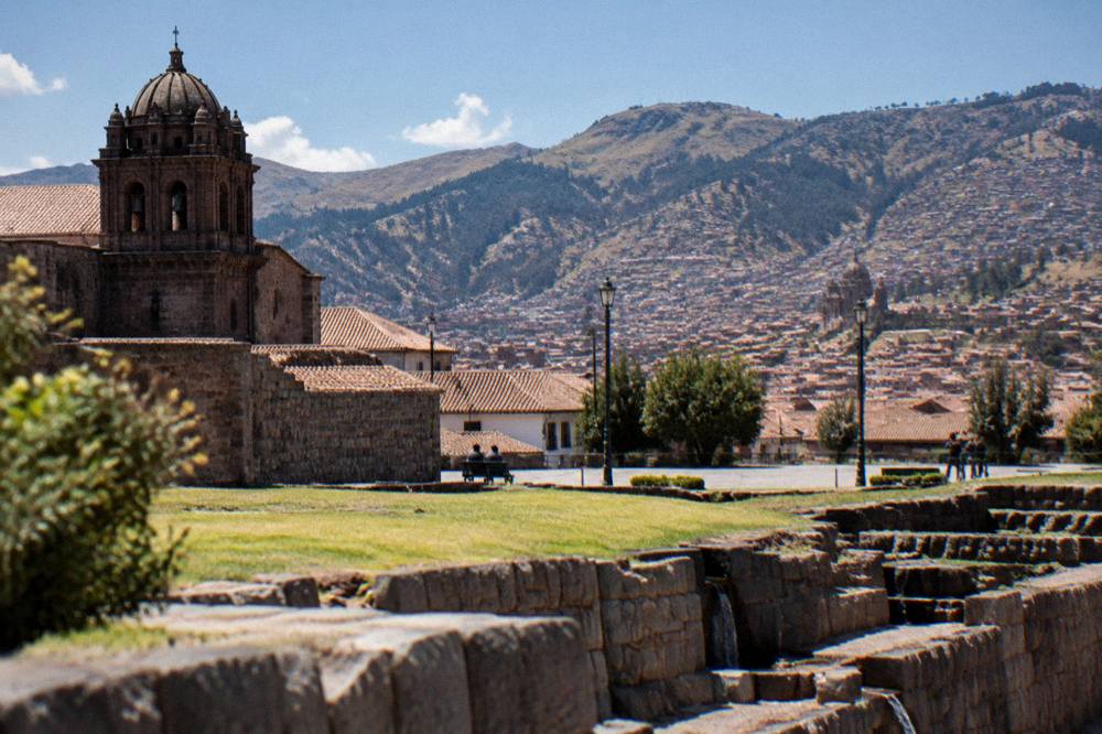 View across the Plaza de Armas toward the hills of Cusco