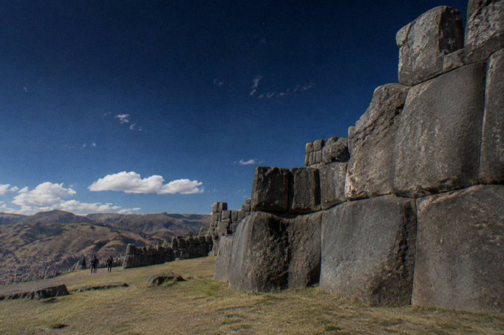 A dark high-altitude sky above Andean hills with stars visible