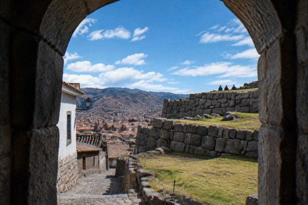 A stone terrace wall at Sacsayhuaman under an afternoon sky