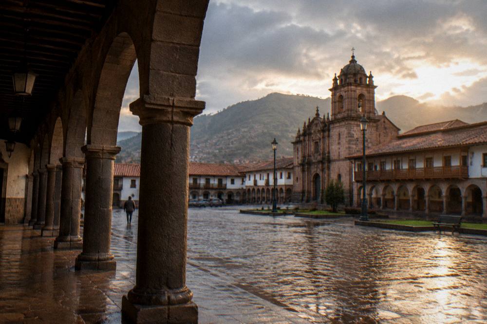 A quiet colonial arcade around an empty plaza in soft rain light