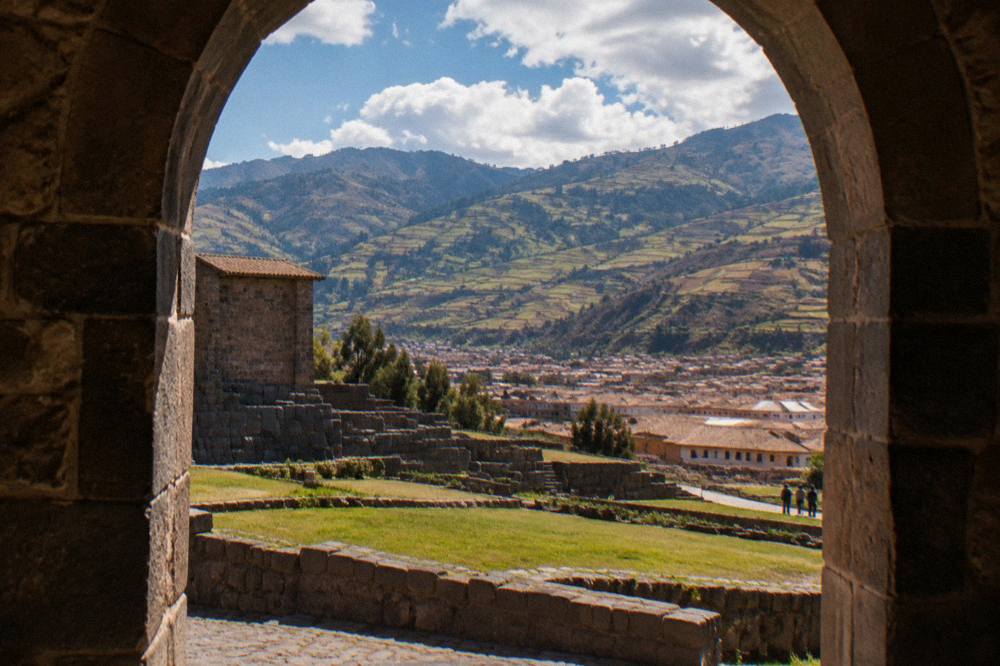 Terraced Andean valley farmland under afternoon cloud