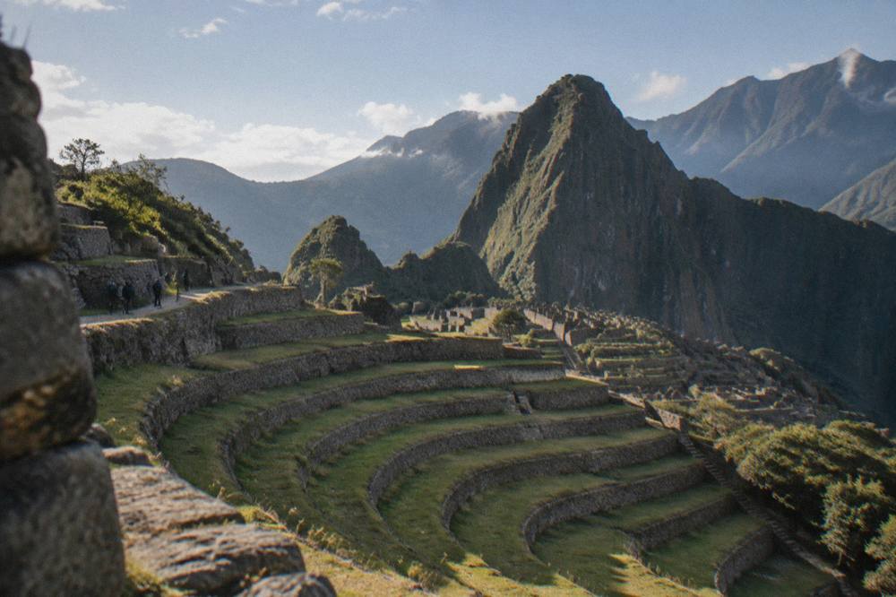 Concentric agricultural terraces cut into a hillside plateau under an open sky