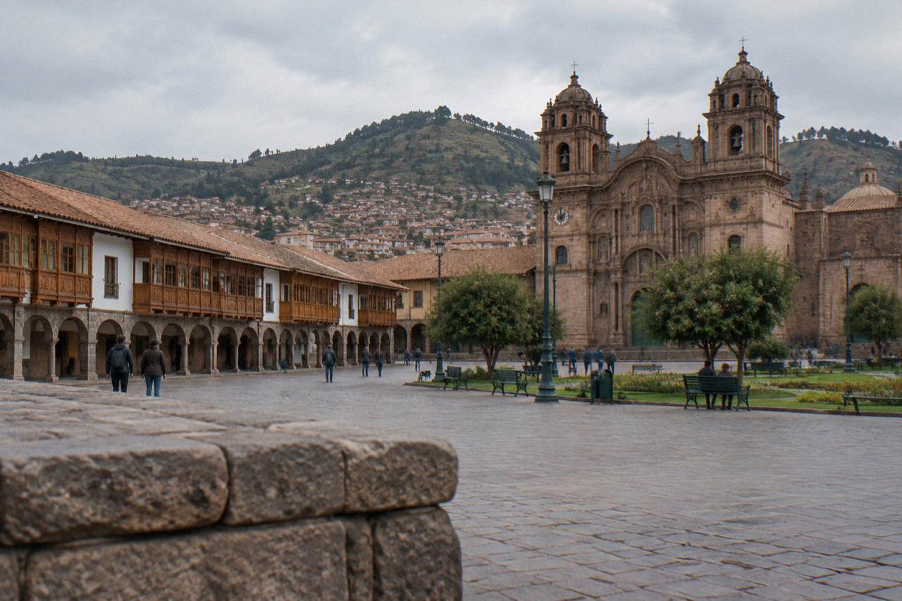 The Plaza de Armas in Cusco with its cathedral and stone arcades under a clear sky