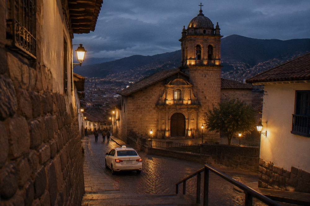 A white taxi with a roof sign parked on a cobbled Cusco street in the evening