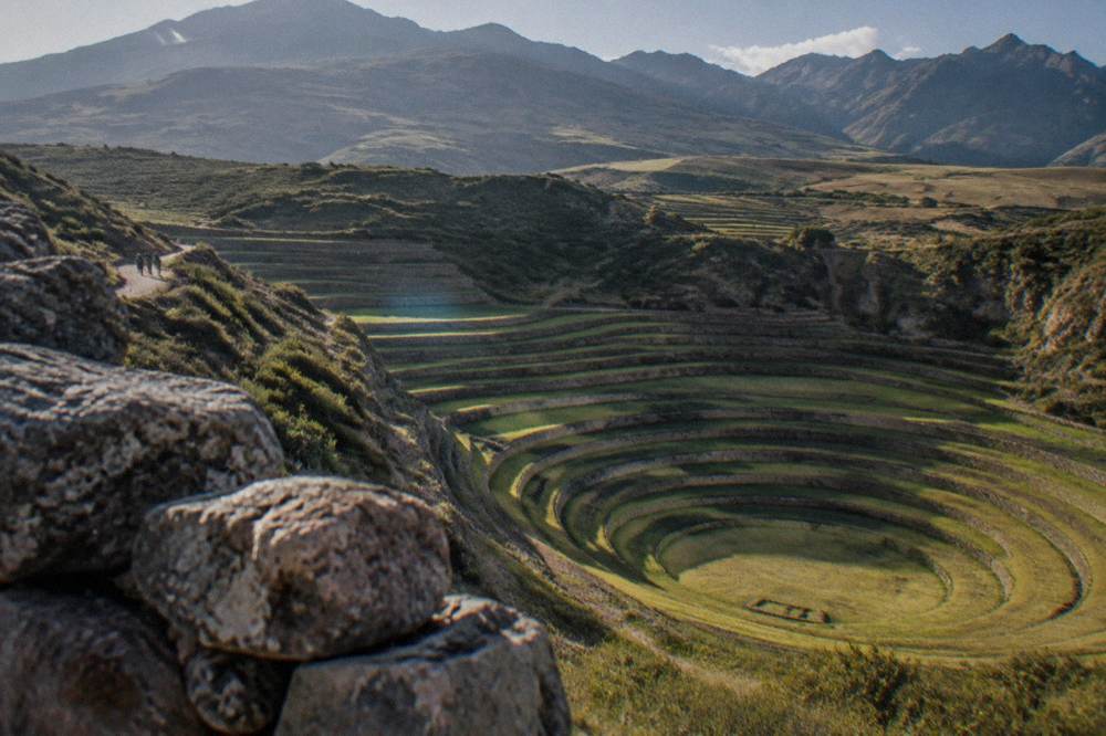 Concentric circular agricultural terraces at Moray seen from the rim under morning light