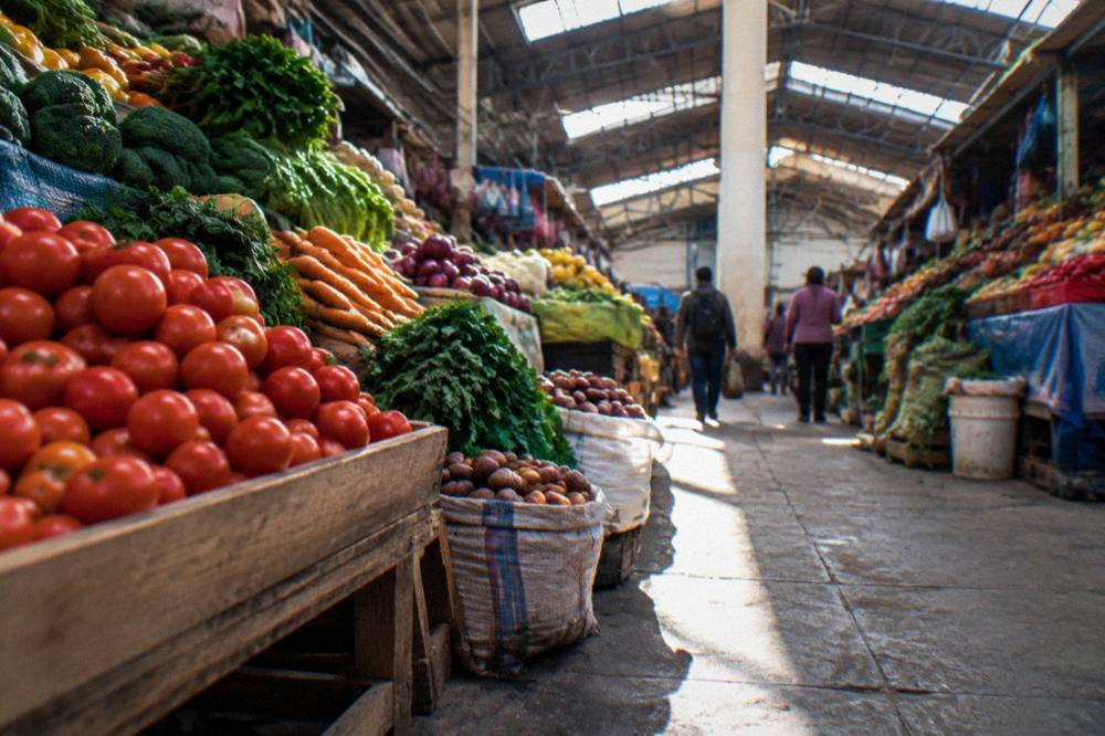 A busy produce aisle inside San Pedro Market in Cusco