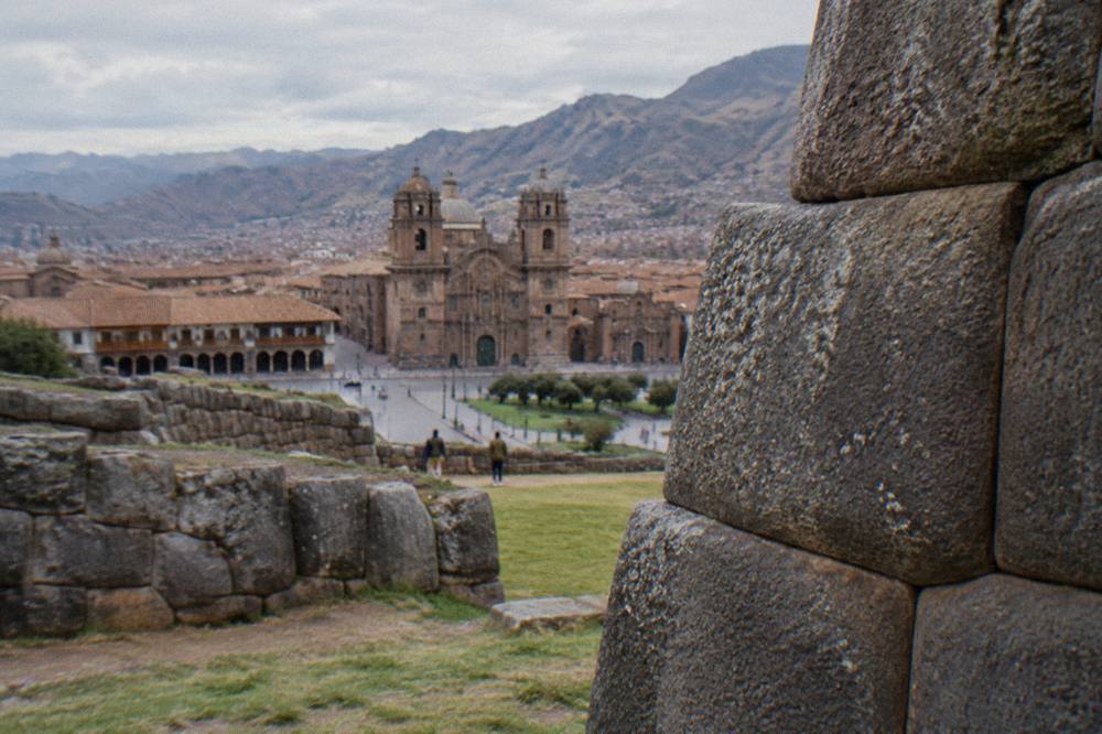 The arcaded Plaza de Armas in Cusco with the Cathedral facade in morning light