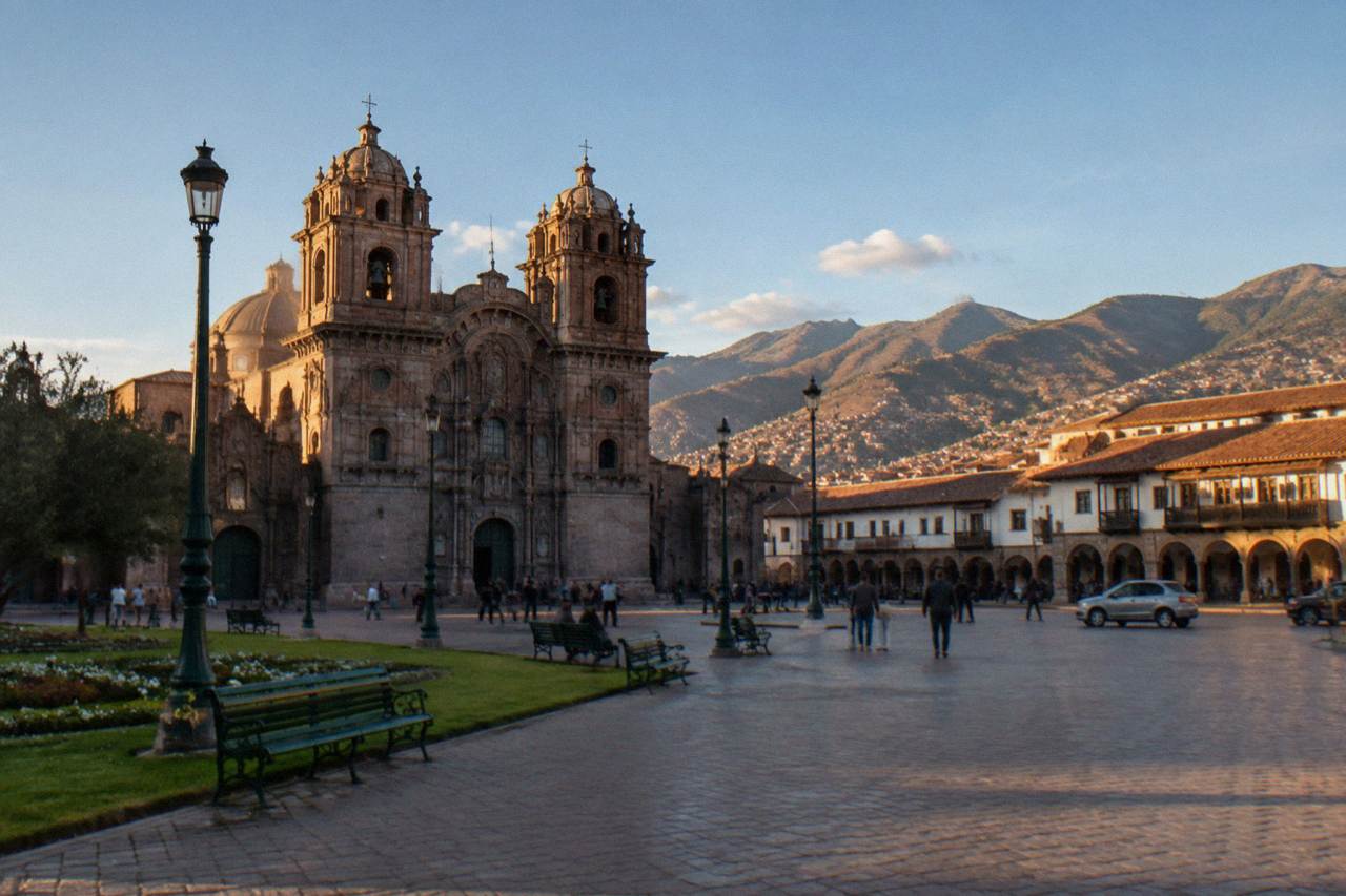 The Plaza de Armas in Cusco with its cathedral and stone arcades under a clear Andean sky