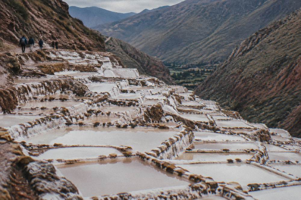Salt evaporation ponds terraced into a hillside at Maras in the Sacred Valley