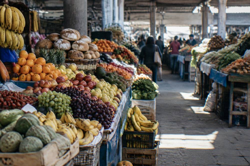Stalls of fruit, bread and produce inside San Pedro Market in Cusco